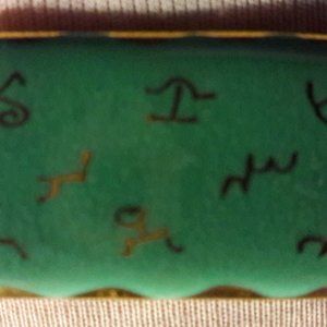 Charming enameled pin